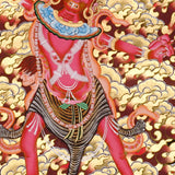 Ekajati Thangka Painting showing a wrathful red Tibetan Buddhist protector goddess with flame aura, sacred implements, skull ornaments, subdued figure, lotus base, offering details and Himalayan landscape background.