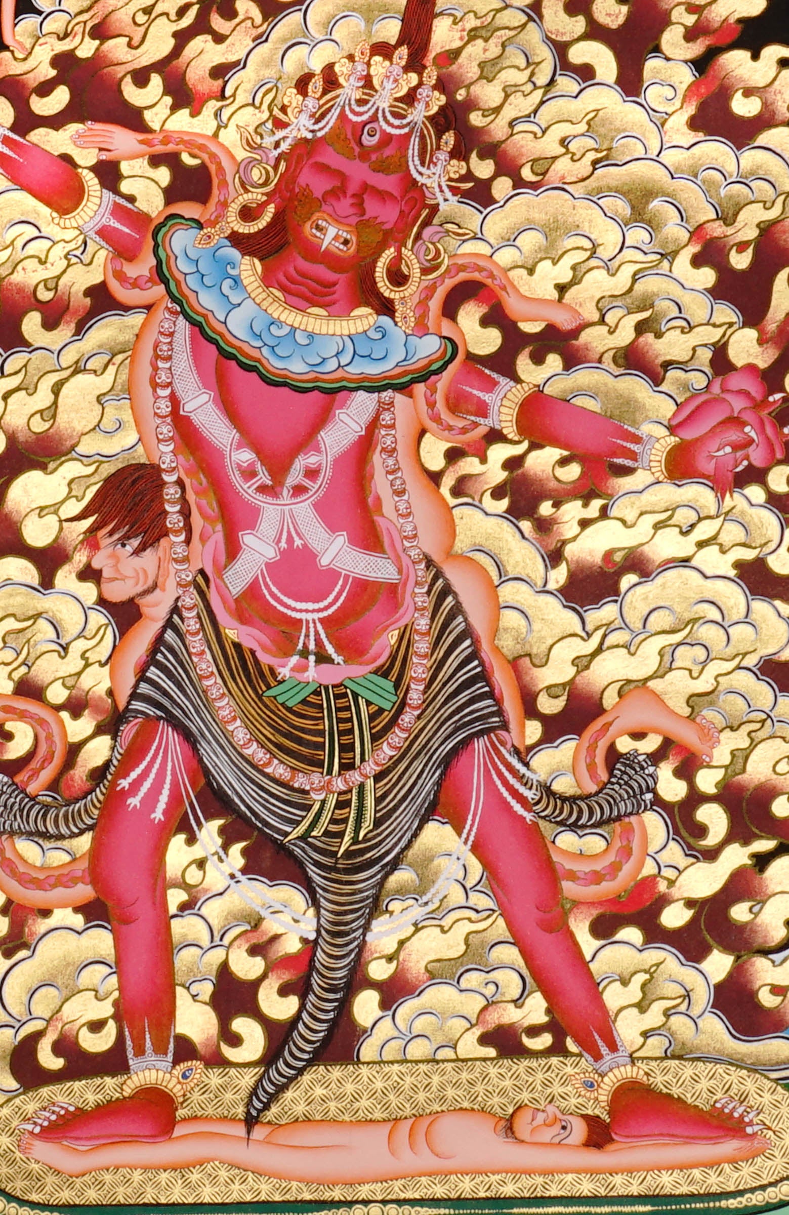 Ekajati Thangka Painting showing a wrathful red Tibetan Buddhist protector goddess with flame aura, sacred implements, skull ornaments, subdued figure, lotus base, offering details and Himalayan landscape background.