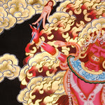 Ekajati Thangka Painting showing a wrathful red Tibetan Buddhist protector goddess with flame aura, sacred implements, skull ornaments, subdued figure, lotus base, offering details and Himalayan landscape background.
