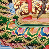 Ekajati Thangka Painting showing a wrathful red Tibetan Buddhist protector goddess with flame aura, sacred implements, skull ornaments, subdued figure, lotus base, offering details and Himalayan landscape background.