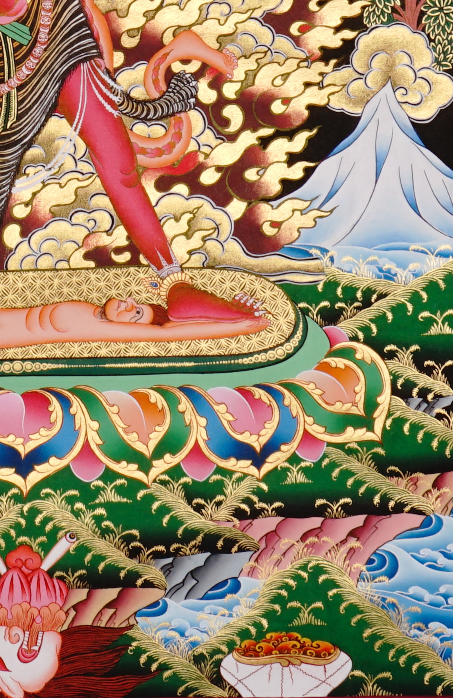 Ekajati Thangka Painting showing a wrathful red Tibetan Buddhist protector goddess with flame aura, sacred implements, skull ornaments, subdued figure, lotus base, offering details and Himalayan landscape background.