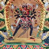 Chakrasambhara Thangka Painting showing in a wrathful form with multiple arms, flame aura, skull ornaments, sacred implements, lotus base and Himalayan landscape details.
