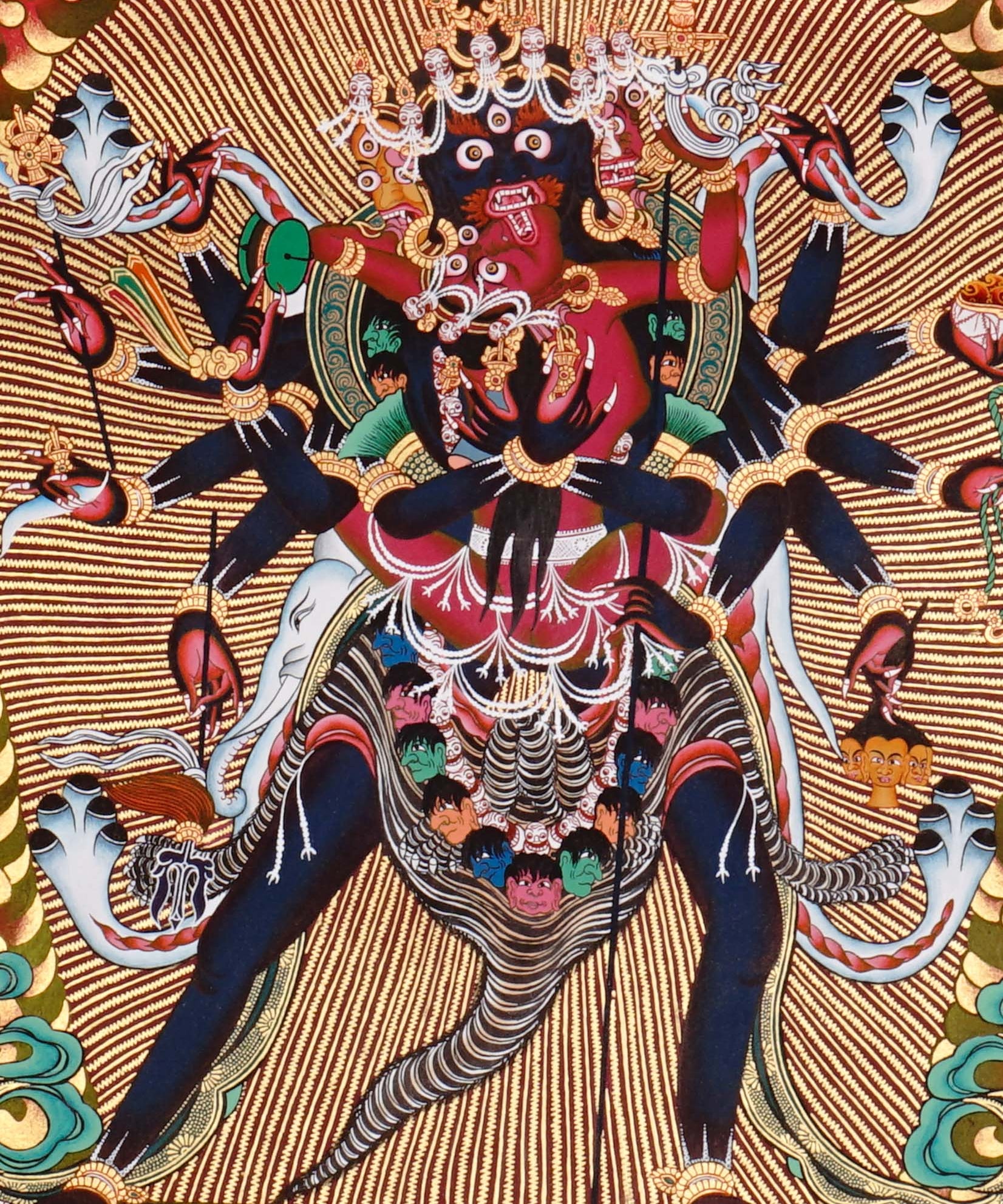 Chakrasambhara Thangka Painting showing in a wrathful form with multiple arms, flame aura, skull ornaments, sacred implements, lotus base and Himalayan landscape details.