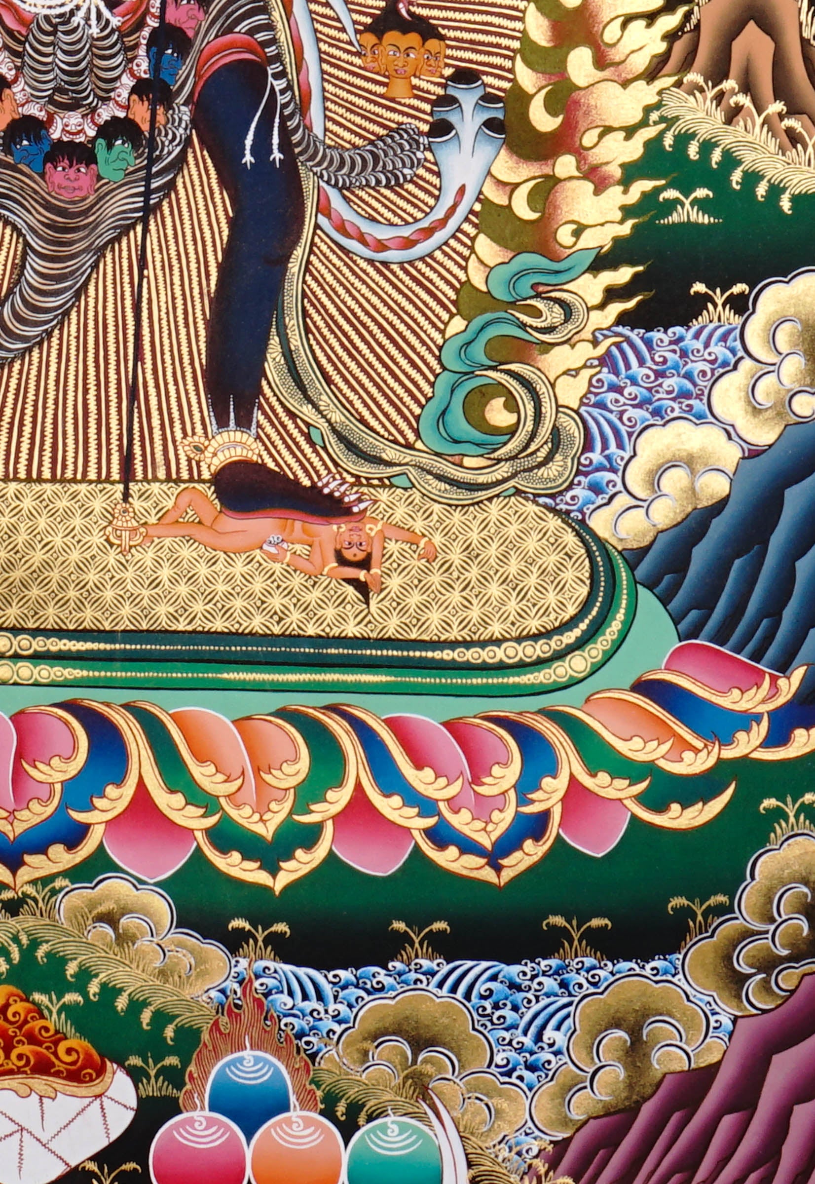Chakrasambhara Thangka Painting showing in a wrathful form with multiple arms, flame aura, skull ornaments, sacred implements, lotus base and Himalayan landscape details.