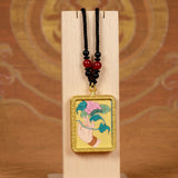 Lotus ghau pendant close up hand painted Himalayan spiritual art