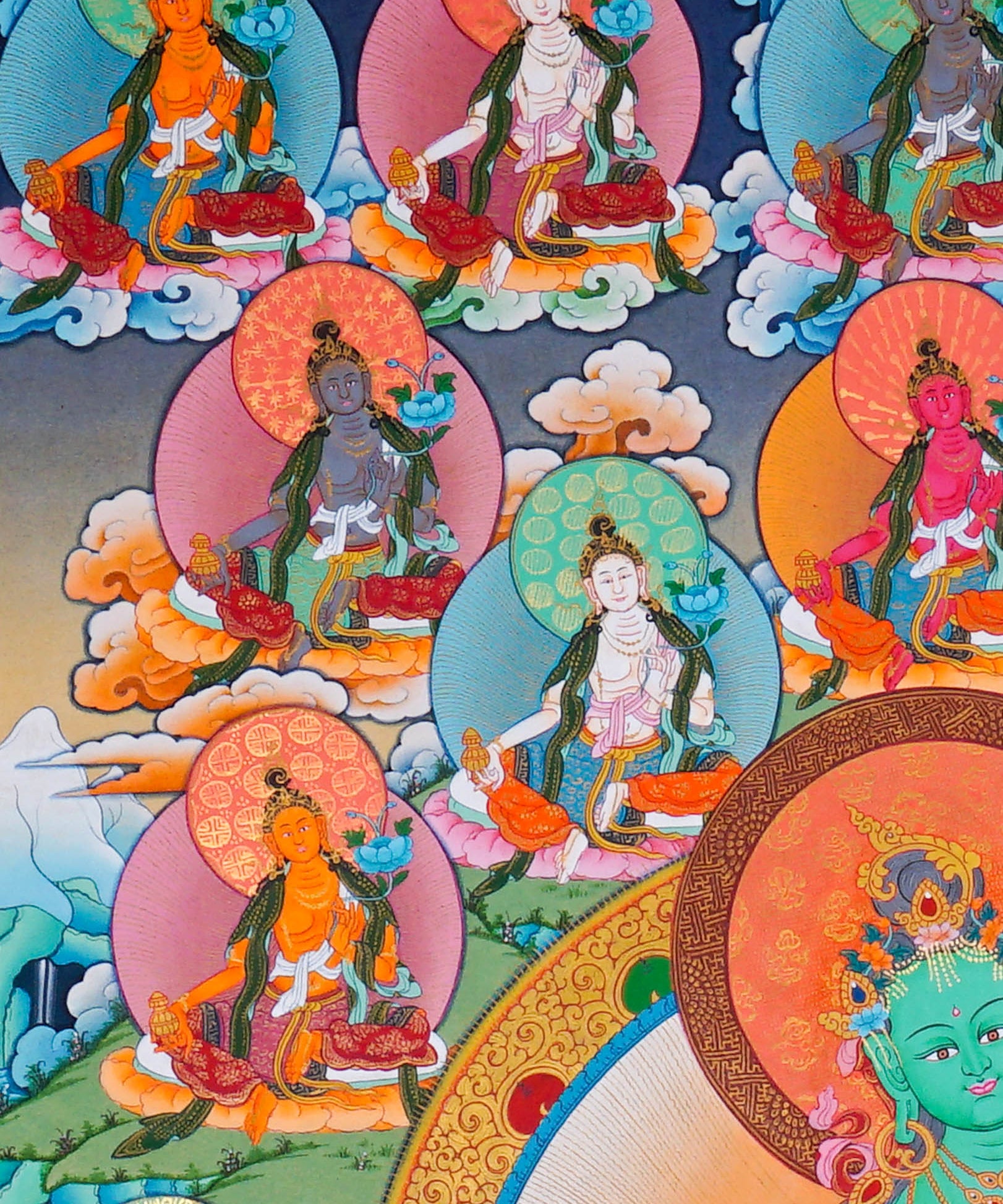 21 Tara Thangka Painting showing Green Tara seated at the centre with blue lotus flowers, surrounded by the Twenty-One Taras in different colours, lotus thrones, radiant halos, clouds, water and Himalayan landscape details.