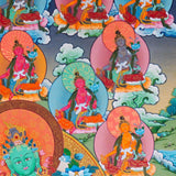 21 Tara Thangka Painting showing Green Tara seated at the centre with blue lotus flowers, surrounded by the Twenty-One Taras in different colours, lotus thrones, radiant halos, clouds, water and Himalayan landscape details.