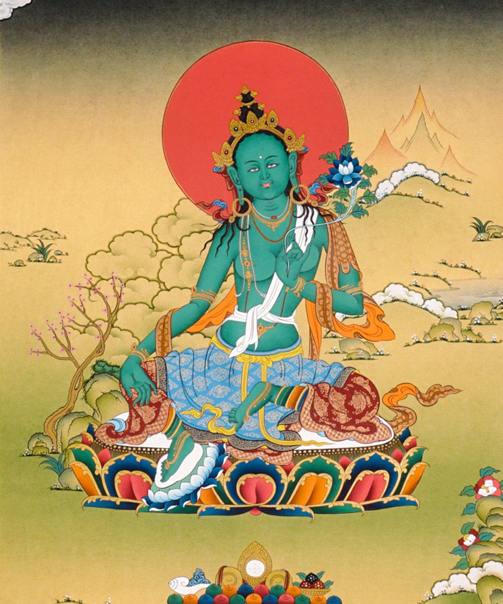 Green Tara Thangka painting with lotus throne, blue utpala flower, serene landscape, and Tibetan Buddhist compassion symbolism.