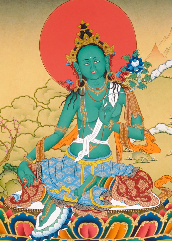 Green Tara Thangka painting with lotus throne, blue utpala flower, serene landscape, and Tibetan Buddhist compassion symbolism.