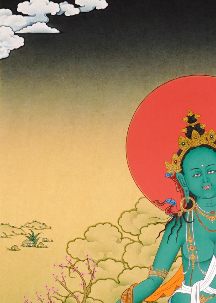 Green Tara Thangka painting with lotus throne, blue utpala flower, serene landscape, and Tibetan Buddhist compassion symbolism.