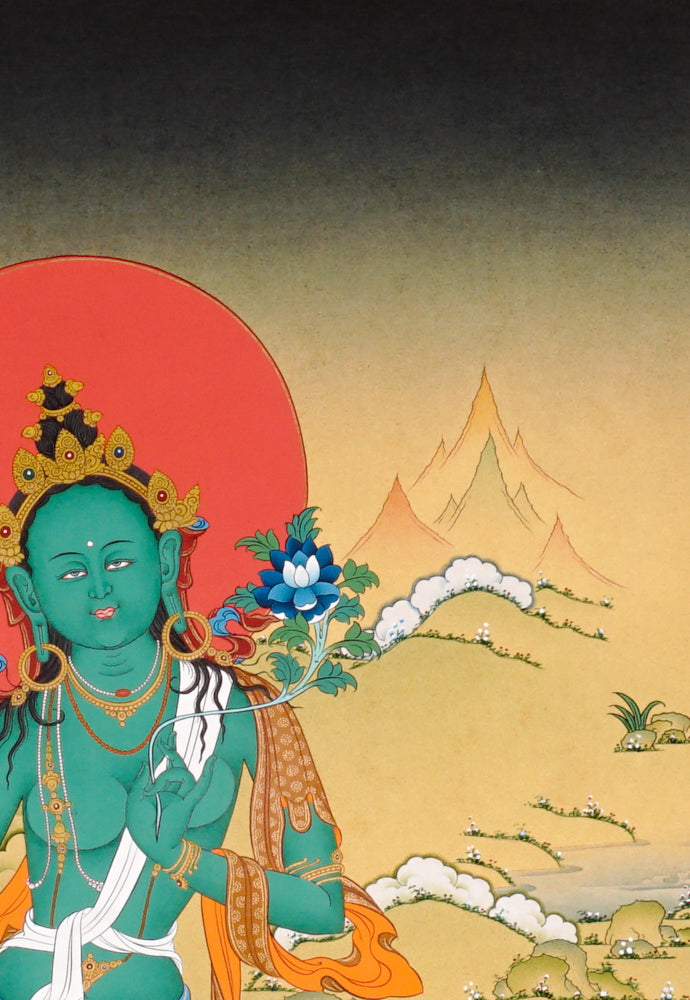 Green Tara Thangka painting with lotus throne, blue utpala flower, serene landscape, and Tibetan Buddhist compassion symbolism.