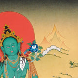 Green Tara Thangka painting with lotus throne, blue utpala flower, serene landscape, and Tibetan Buddhist compassion symbolism.