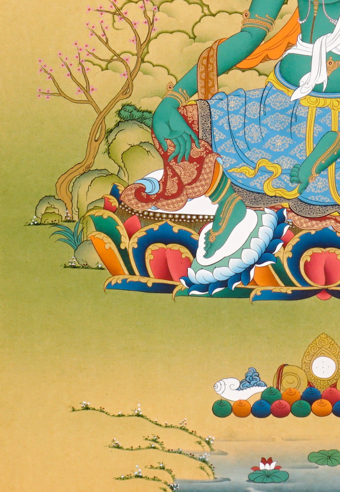Green Tara Thangka painting with lotus throne, blue utpala flower, serene landscape, and Tibetan Buddhist compassion symbolism.