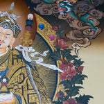 Guru Rinpoche Thangka Painting  seated on a lotus throne with vajra, skull cup, khatvanga staff, radiant halo, two supporting female figures, offering bowl, dragons, clouds and Himalayan landscape details.