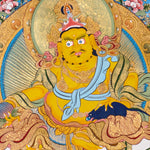 Yellow Zambhala thangka with Tibetan Buddhist wealth deity seated on lotus seat