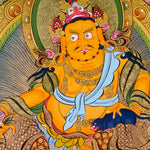 Yellow Zambhala thangka with Tibetan Buddhist wealth deity seated on lotus throne