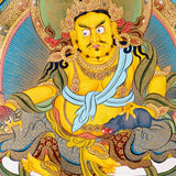 Yellow Zambhala thangka with Tibetan Buddhist wealth deity seated on lotus throne