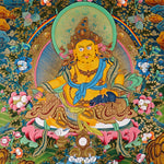 Yellow Zambhala thangka with prosperity deity seated on lotus throne