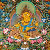 Yellow Zambhala thangka with prosperity deity seated on lotus throne