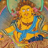 Yellow Zambhala thangka with prosperity deity seated on lotus throne