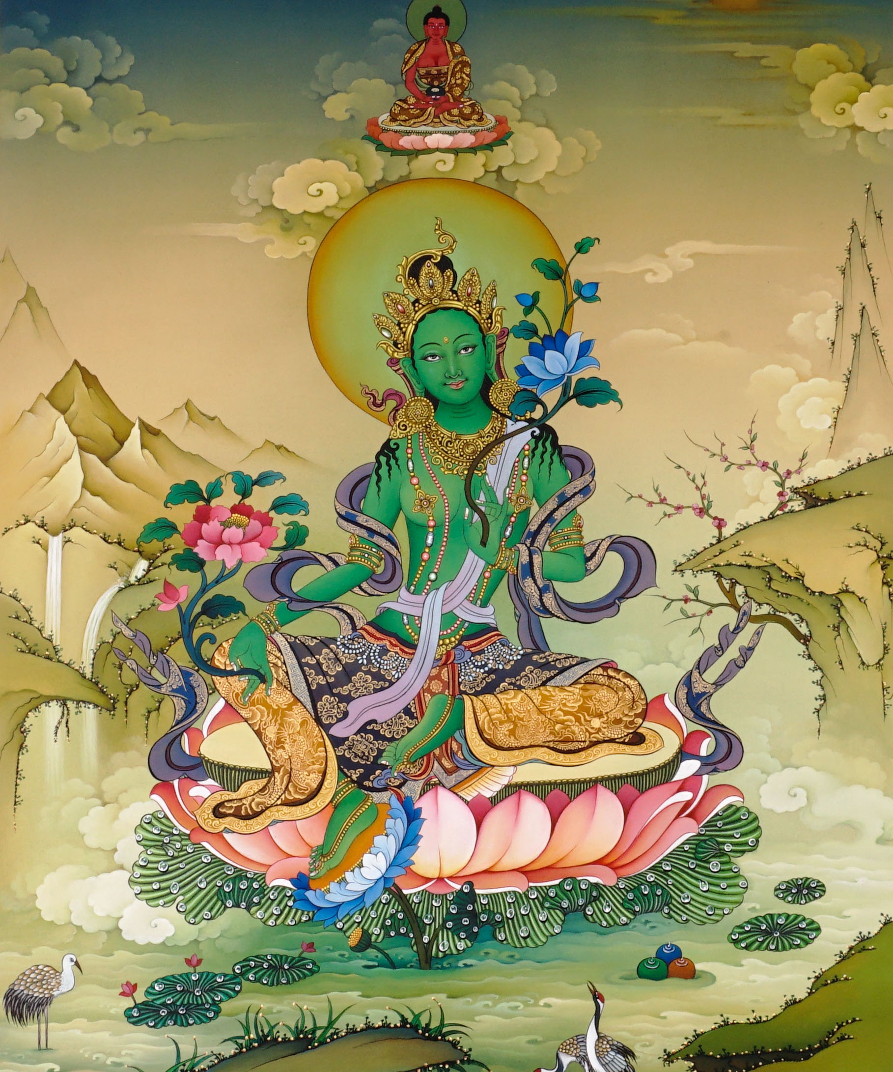 Green Tara thangka painting Tibetan goddess seated on lotus holding blue lotus in detailed Himalayan landscape