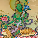 Green Tara thangka painting Tibetan goddess seated on lotus holding blue lotus in detailed Himalayan landscape