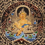 Zambhala Mandala Thangka painting with central prosperity deity, sacred Tibetan script, and traditional Himalayan Buddhist symbolism.
