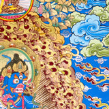 Black Zambhala thangka with wrathful wealth deity surrounded by golden flames