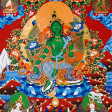 Green Tara Thangka painting with lotus throne, floral branches, celestial Buddhas, and Tibetan Buddhist compassion symbolism.