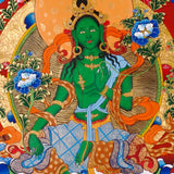 Green Tara Thangka painting with lotus throne, floral branches, celestial Buddhas, and Tibetan Buddhist compassion symbolism.