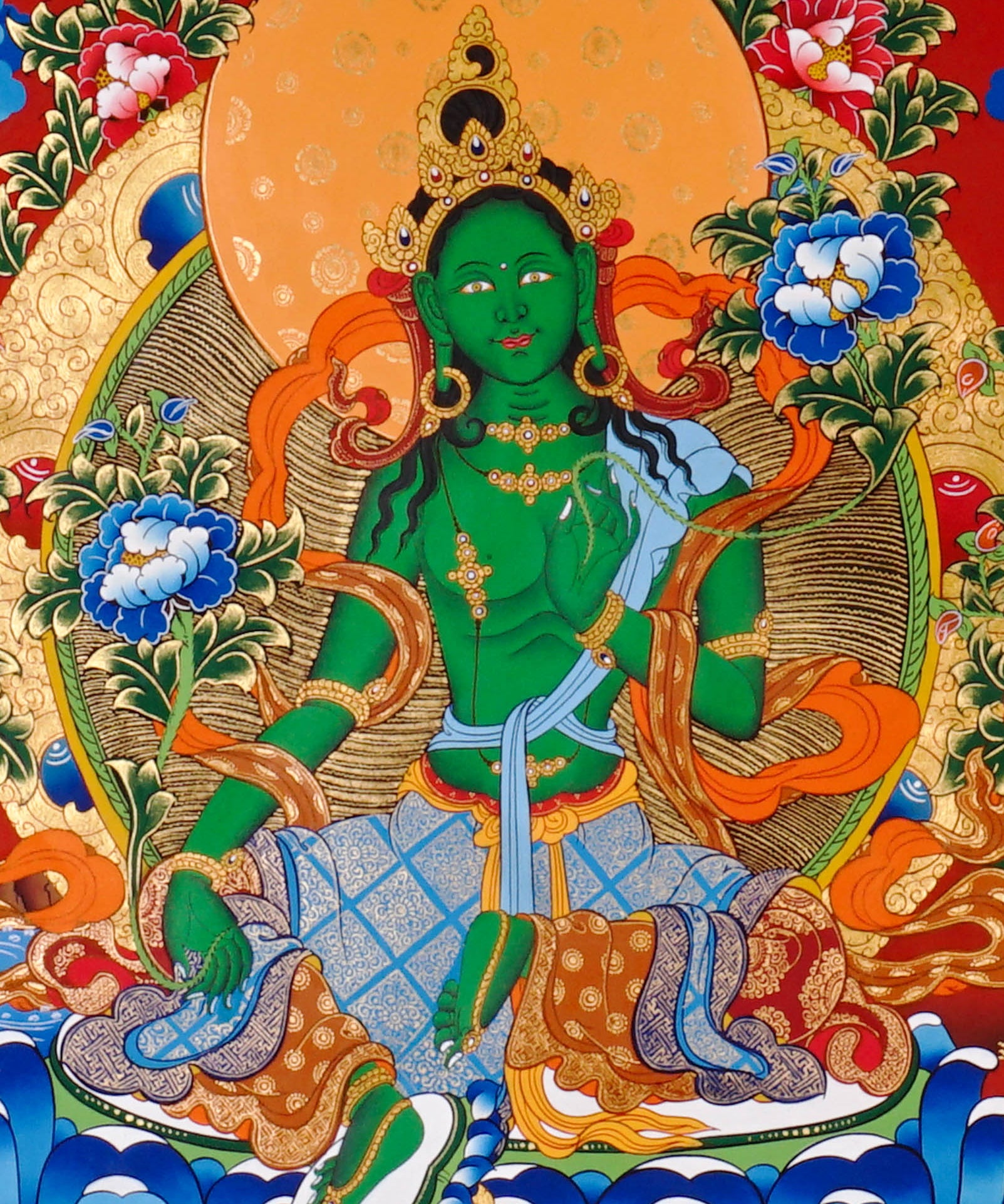 Green Tara Thangka painting with lotus throne, floral branches, celestial Buddhas, and Tibetan Buddhist compassion symbolism.