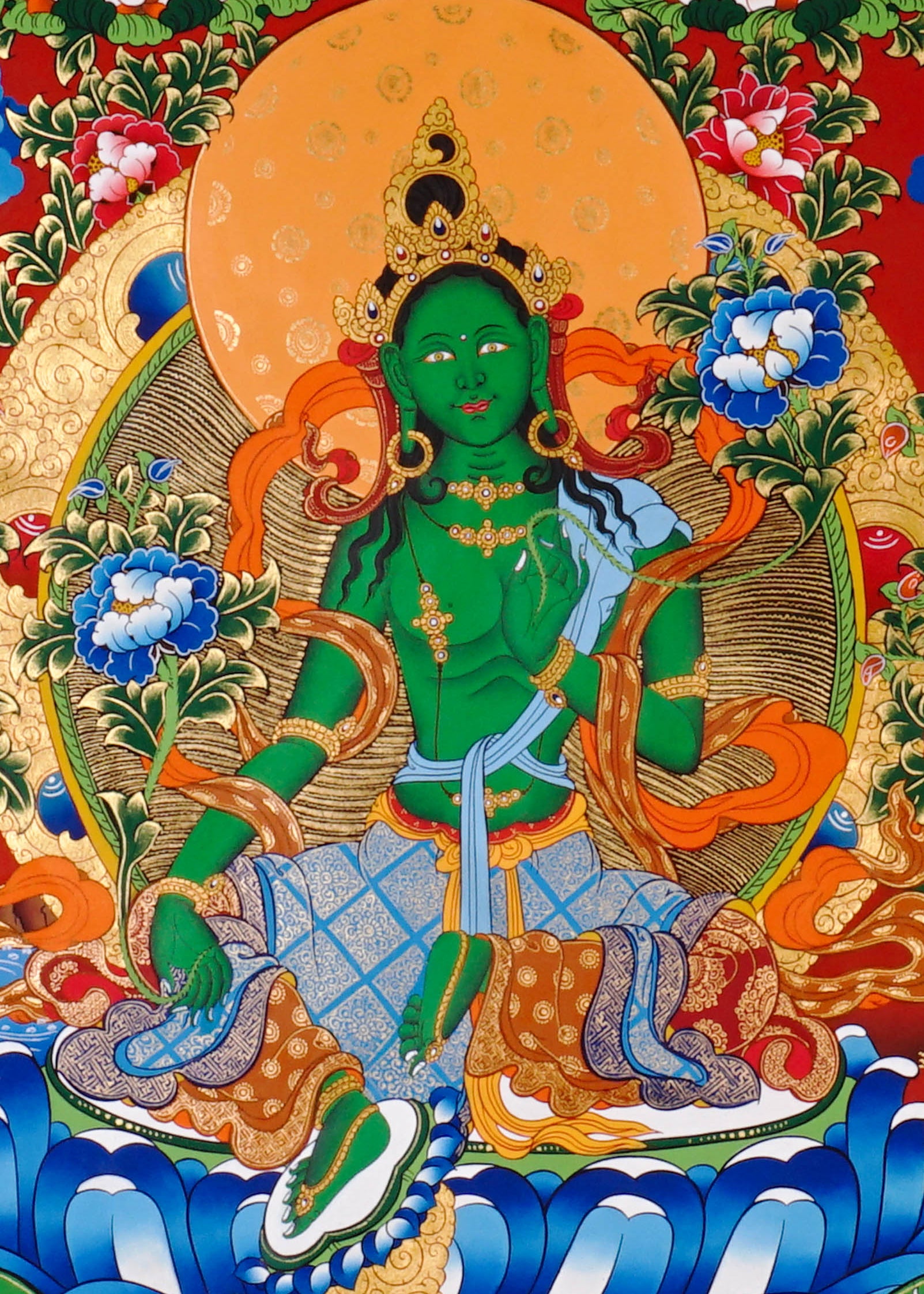 Green Tara Thangka painting with lotus throne, floral branches, celestial Buddhas, and Tibetan Buddhist compassion symbolism.