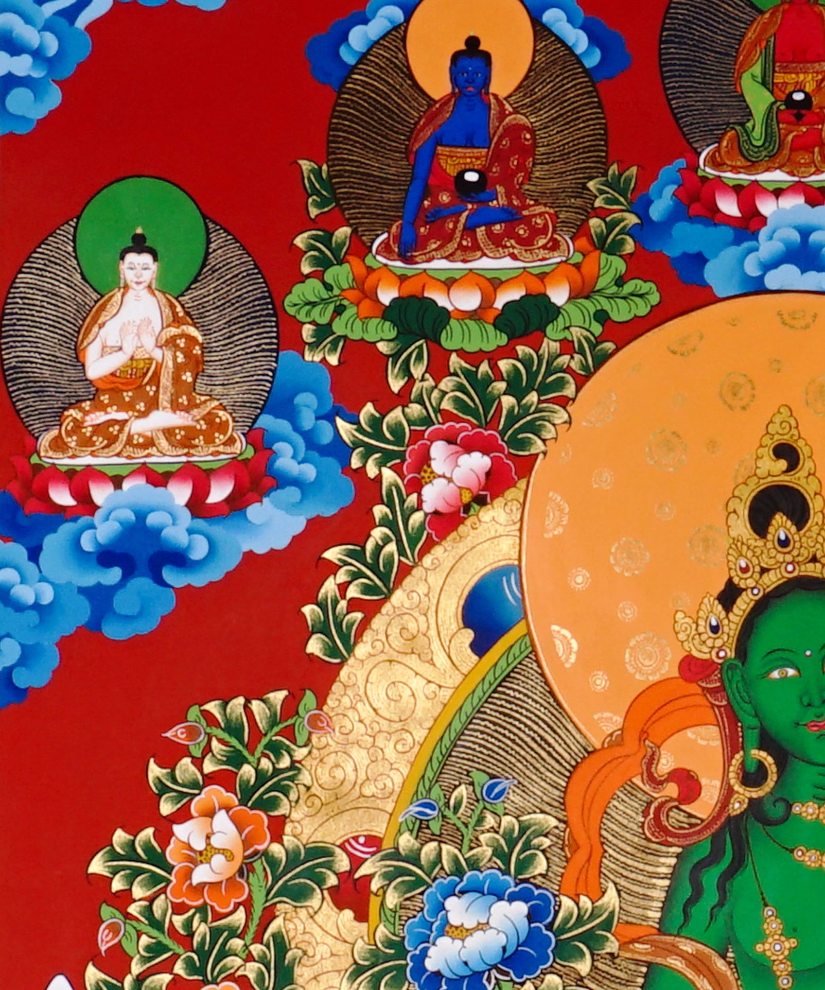 Green Tara Thangka painting with lotus throne, floral branches, celestial Buddhas, and Tibetan Buddhist compassion symbolism.