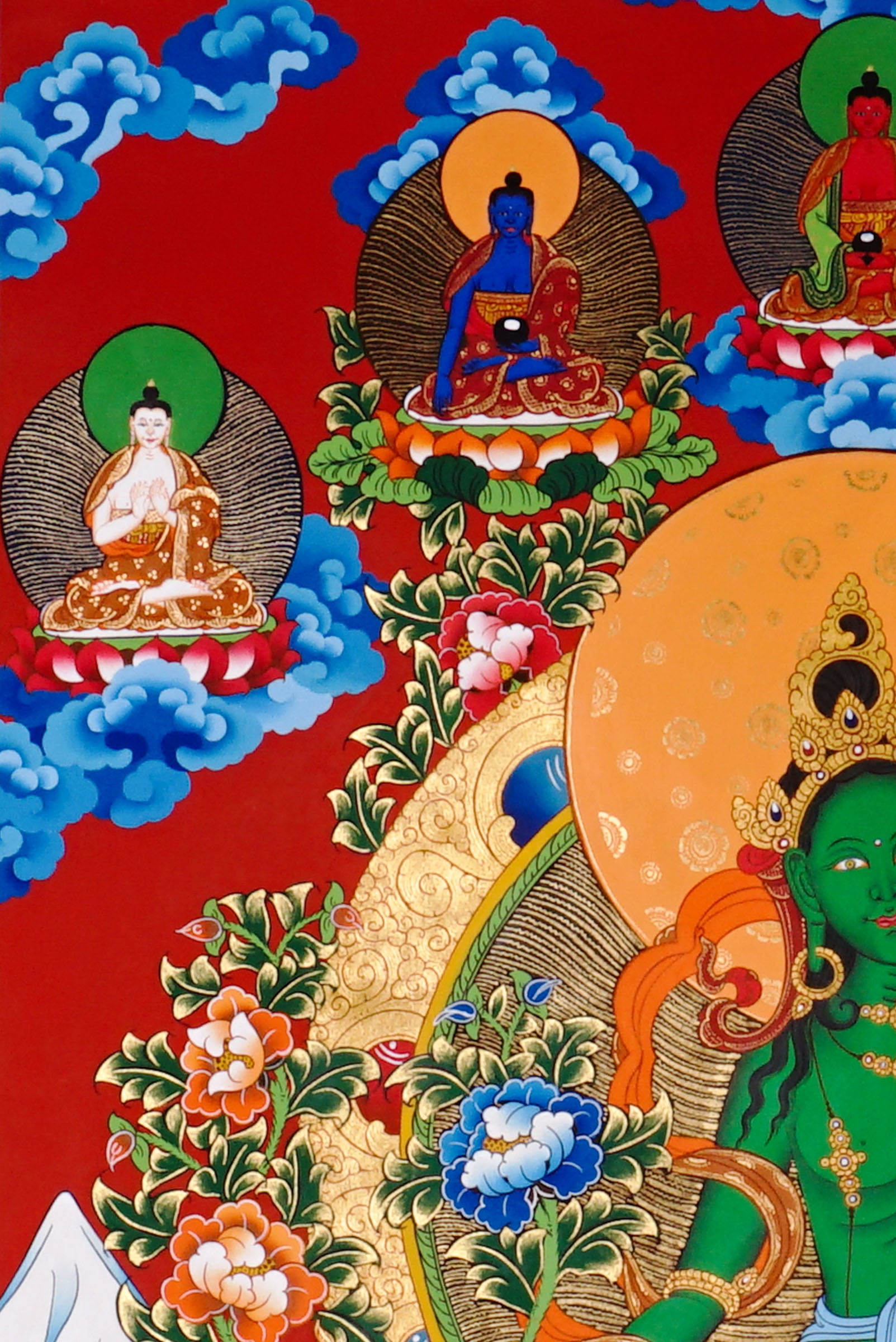 Green Tara Thangka painting with lotus throne, floral branches, celestial Buddhas, and Tibetan Buddhist compassion symbolism.