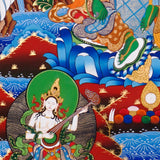 Green Tara Thangka painting with lotus throne, floral branches, celestial Buddhas, and Tibetan Buddhist compassion symbolism.