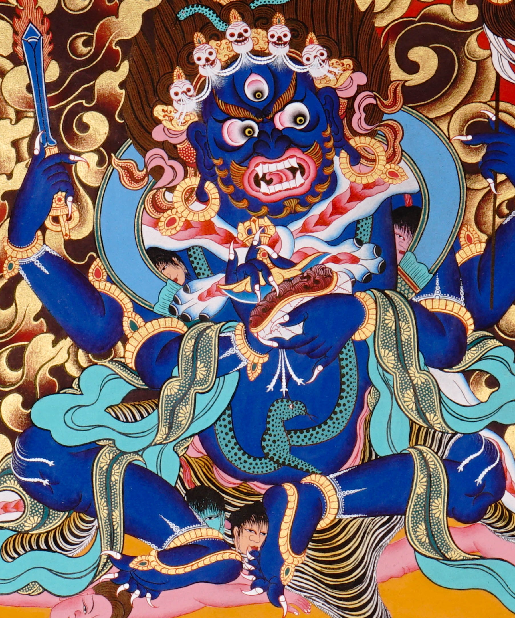Mahakala Thangka painting with flame halo, lotus base, multiple arms, skull ornaments, and Tibetan Buddhist protector symbolism