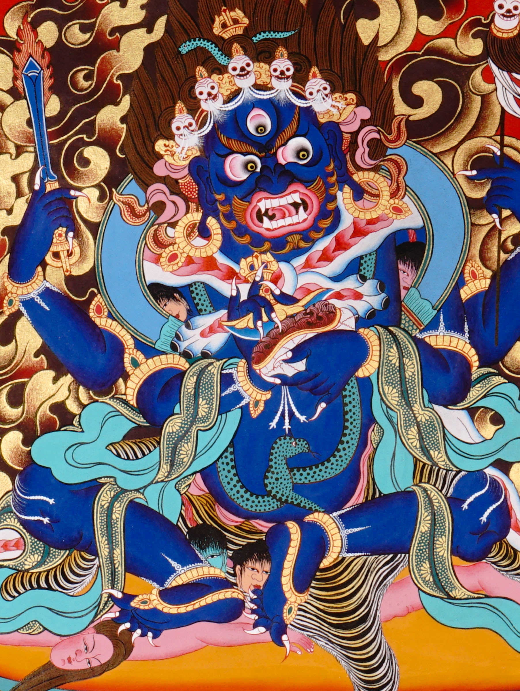 Mahakala Thangka painting with flame halo, lotus base, multiple arms, skull ornaments, and Tibetan Buddhist protector symbolism
