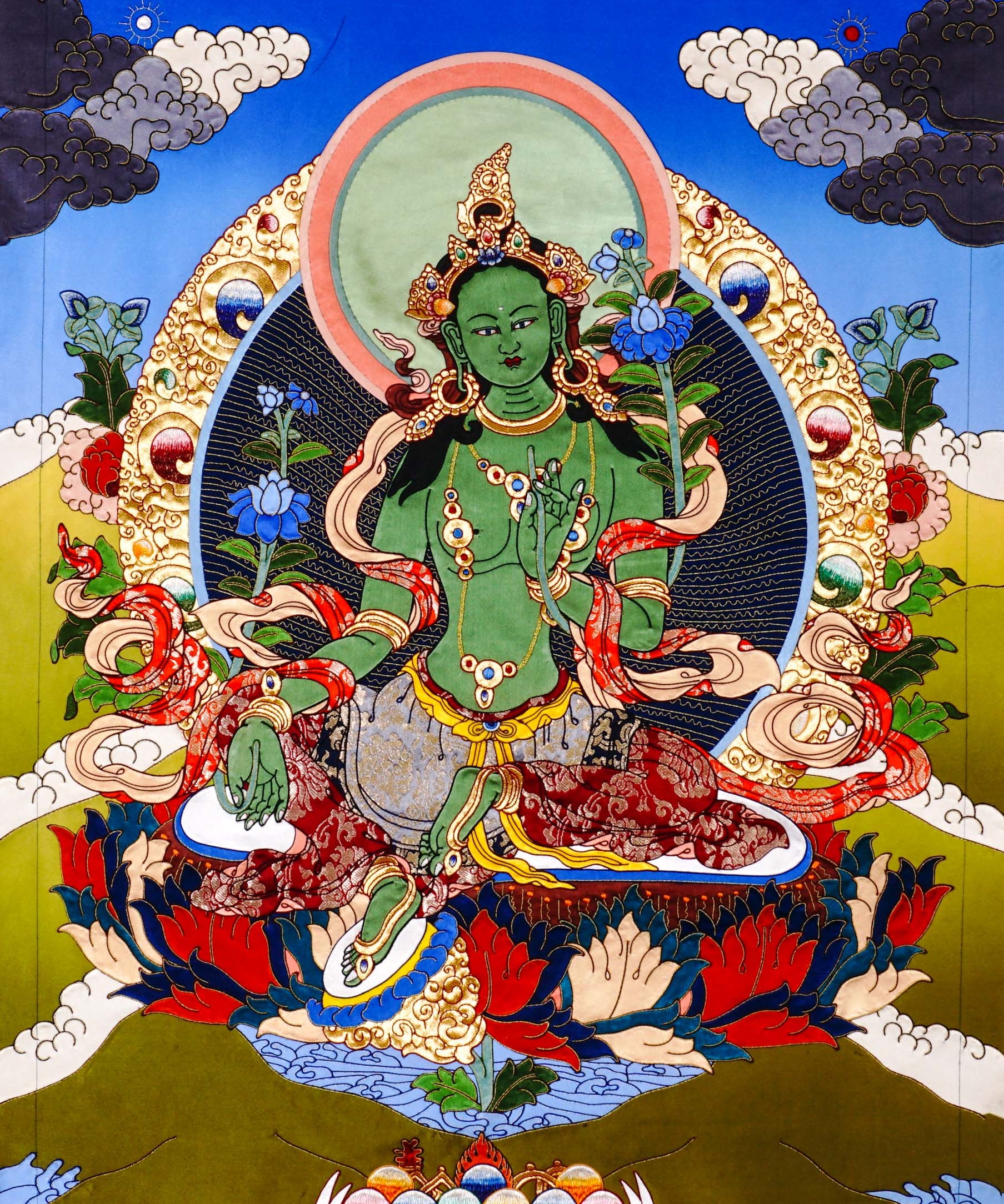 Green Tara thangka painting Tibetan goddess seated on lotus holding blue lotus in detailed traditional composition