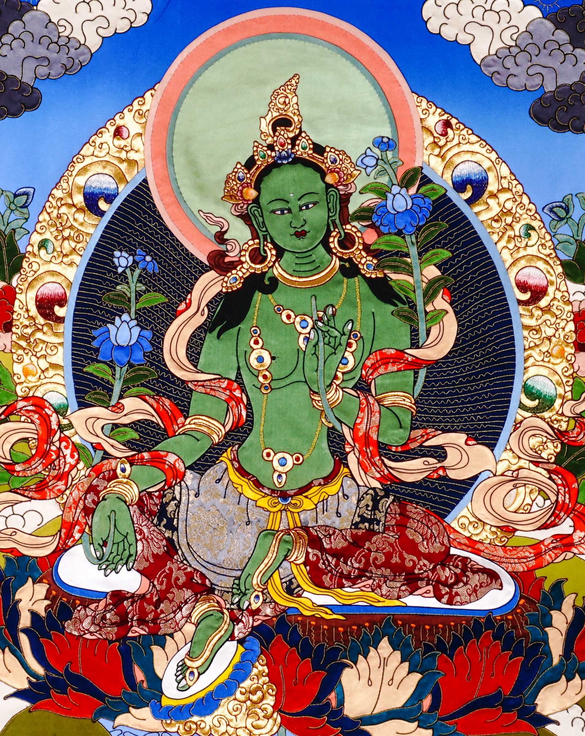 Green Tara thangka painting Tibetan goddess seated on lotus holding blue lotus in detailed traditional composition