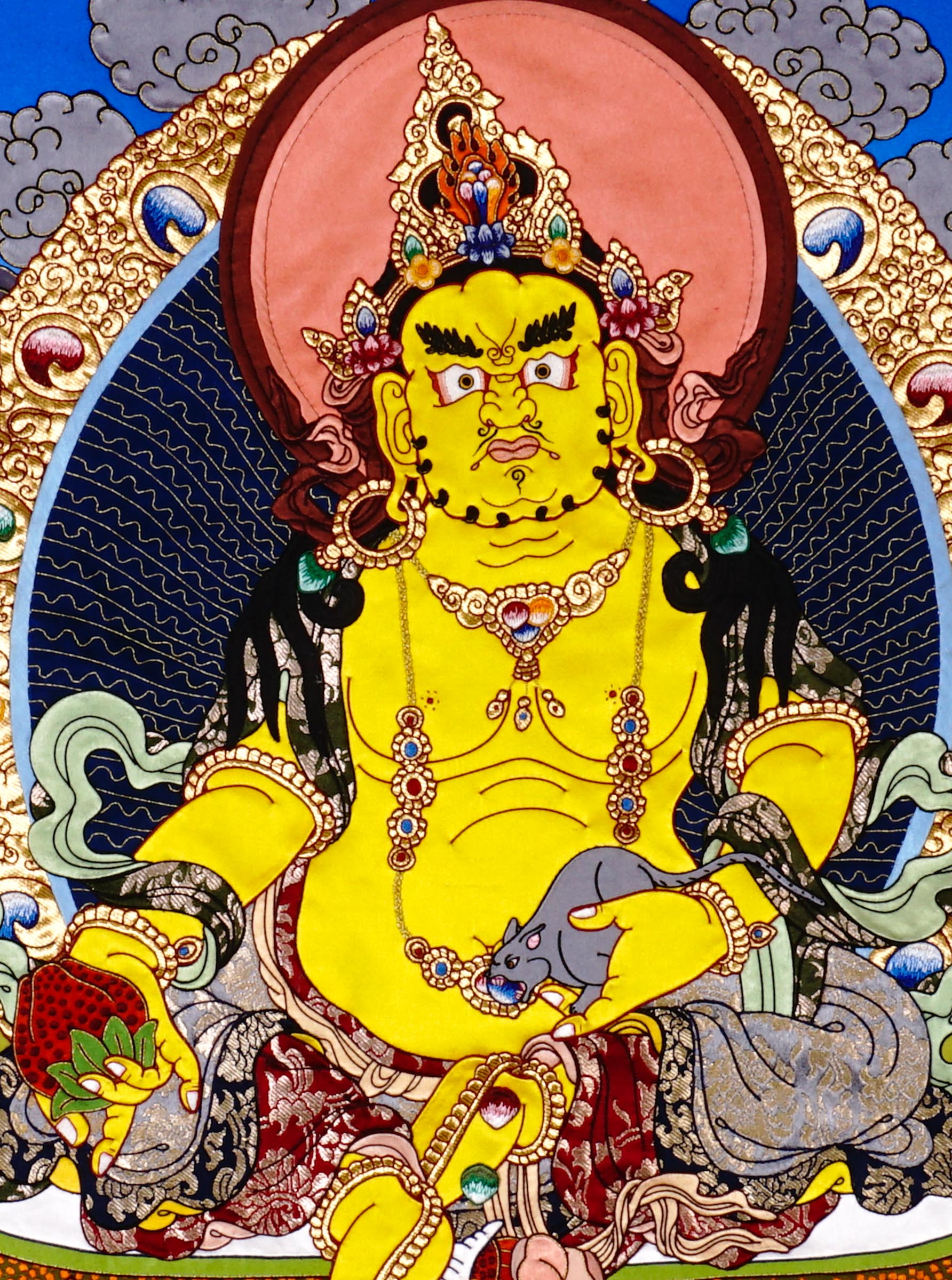 Yellow Zambala thangka painting Tibetan wealth deity seated on lotus holding jewel and mongoose in detailed landscape