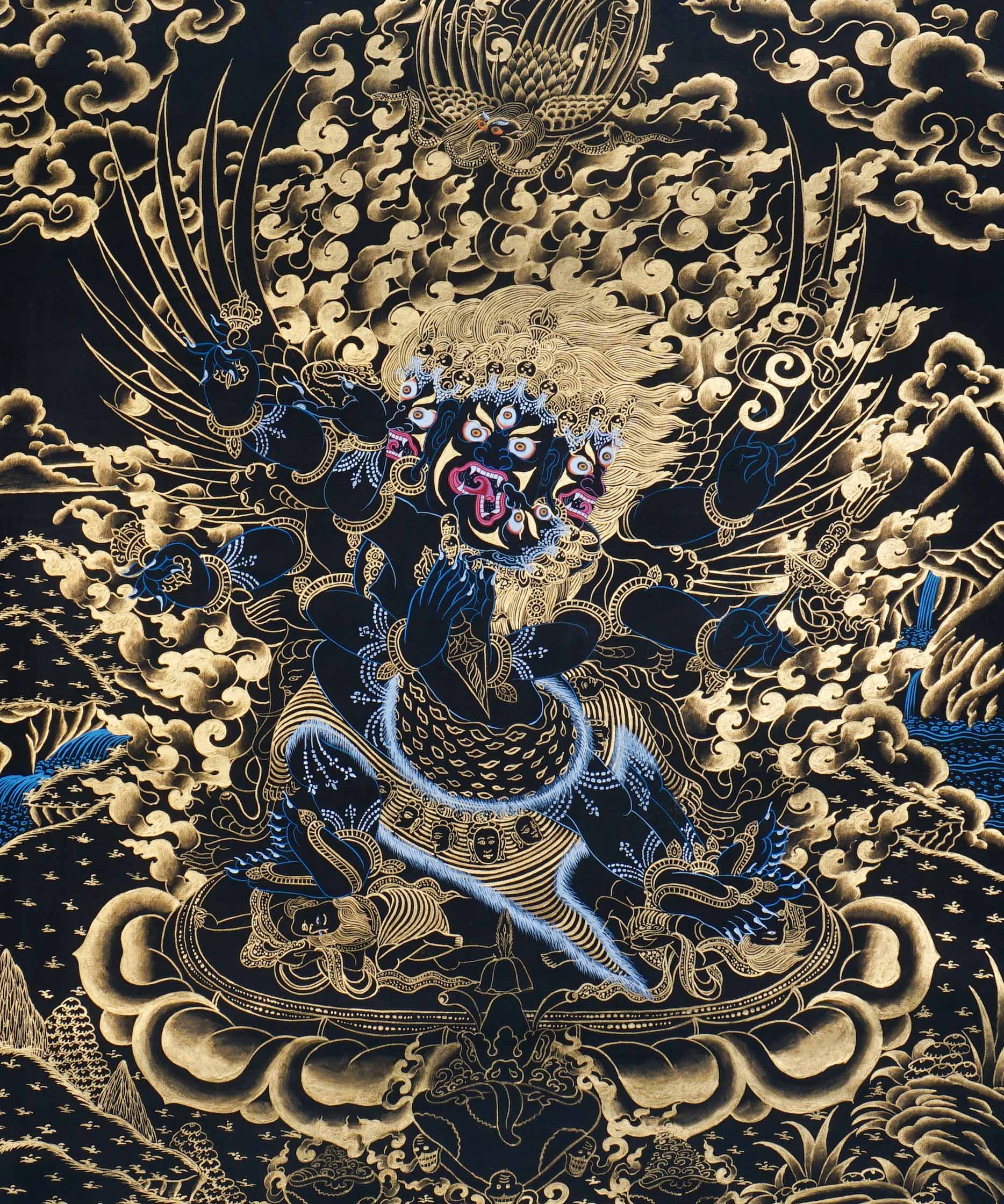 Vajrakilaya Thangka Painting showing Dorje Phurba in a wrathful multi-faced and multi-armed form with ritual implements, flame clouds, lotus base, gold detailing and Himalayan landscape elements.