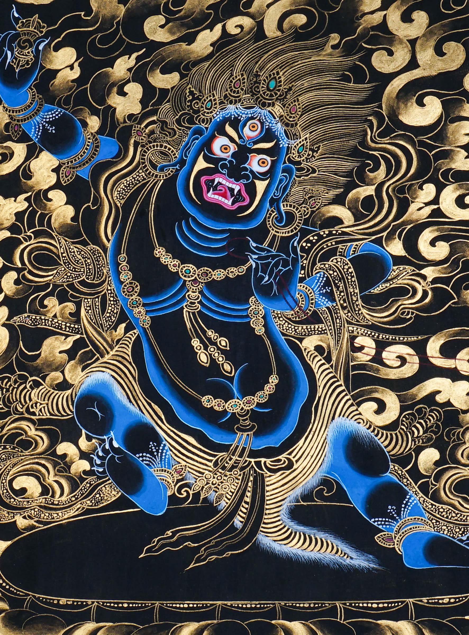 Vajrapani Thangka Painting showing a wrathful Tibetan Buddhist protector deity with multiple faces and arms, ritual implements, gold cloud patterns, flame-like details, lotus base and Himalayan landscape elements