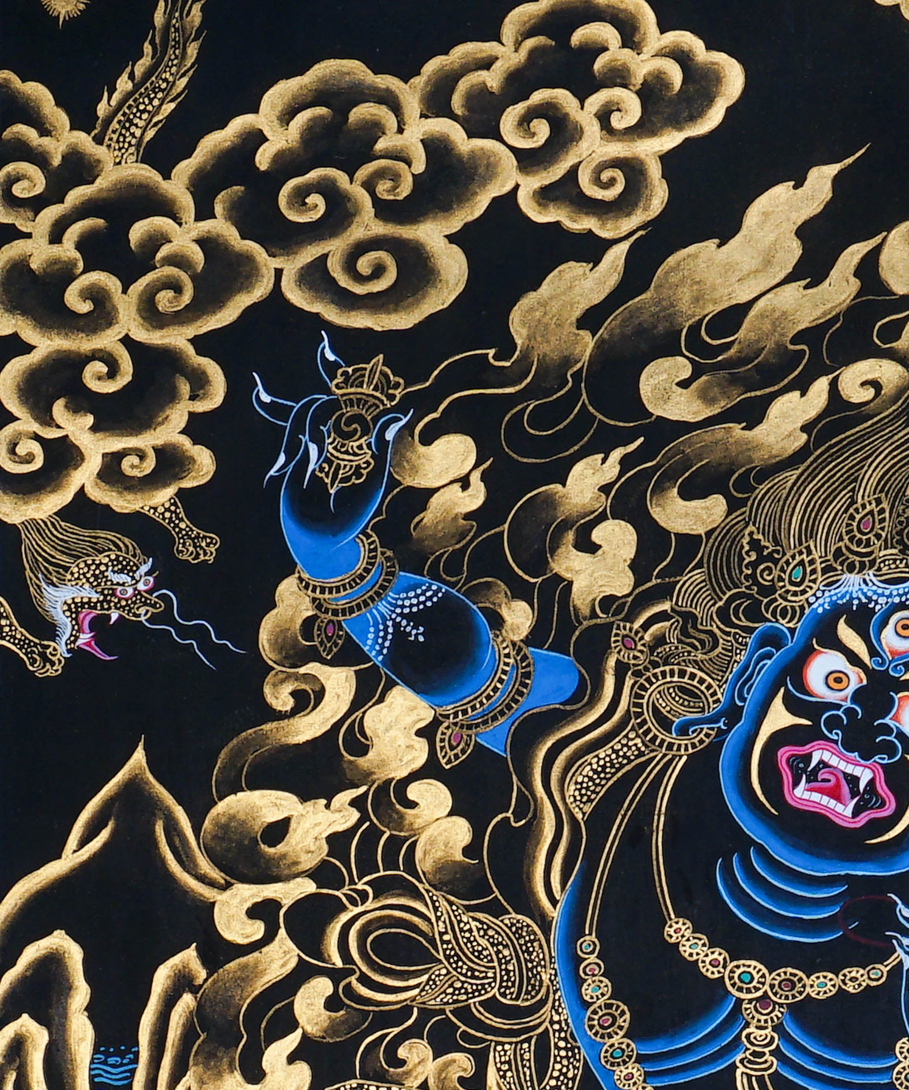 Vajrapani Thangka Painting showing a wrathful Tibetan Buddhist protector deity with multiple faces and arms, ritual implements, gold cloud patterns, flame-like details, lotus base and Himalayan landscape elements