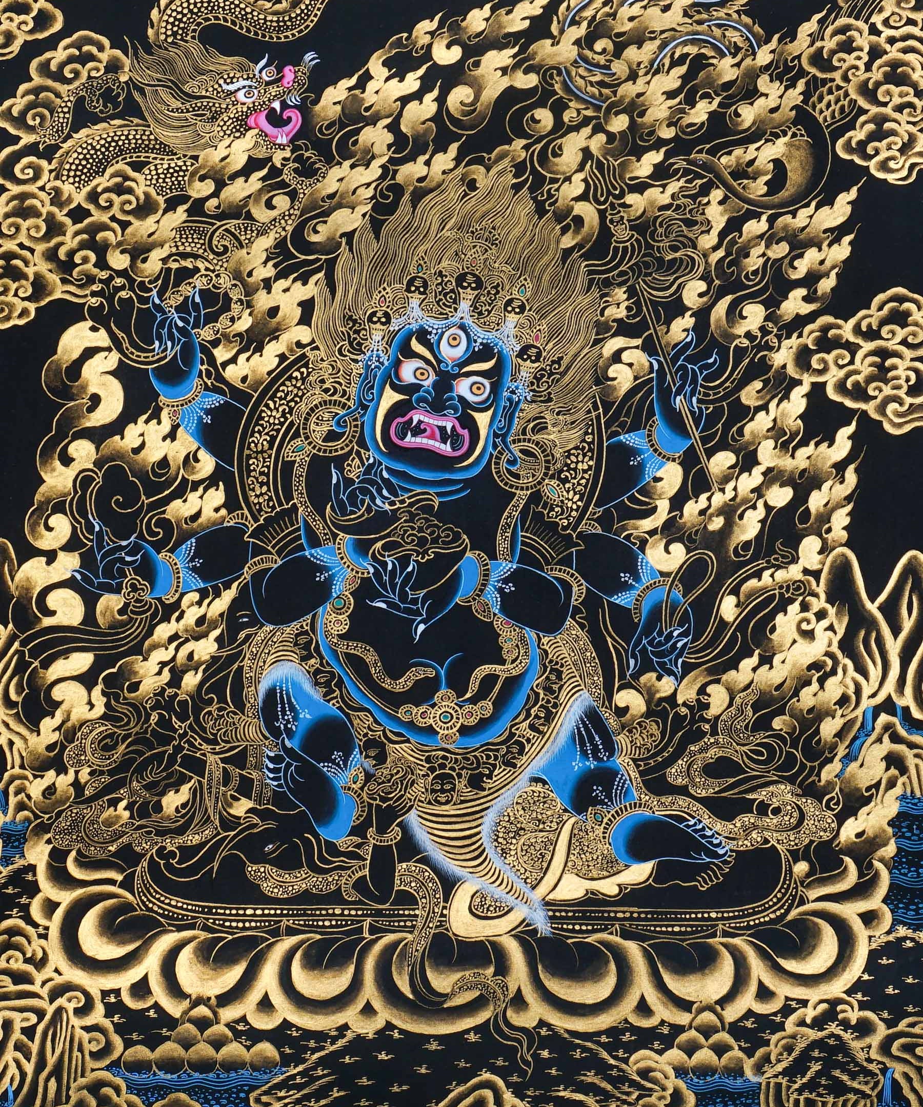 Mahakala thangka painting showing a wrathful blue Mahakala deity with multiple arms, flaming aura, gold clouds, dragon motif, and black background in traditional Tibetan Buddhist style.