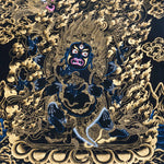 Mahakala thangka painting showing a wrathful blue Mahakala deity with multiple arms, flaming aura, gold clouds, dragon motif, and black background in traditional Tibetan Buddhist style.