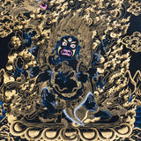 Mahakala thangka painting showing a wrathful blue Mahakala deity with multiple arms, flaming aura, gold clouds, dragon motif, and black background in traditional Tibetan Buddhist style.