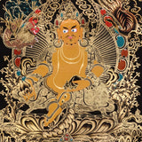 Yellow Zambala Thangka painting with gold detailing, lotus throne, symbolic birds, and Tibetan Buddhist prosperity symbolism.