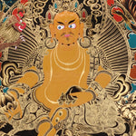 Yellow Zambala Thangka painting with gold detailing, lotus throne, symbolic birds, and Tibetan Buddhist prosperity symbolism.
