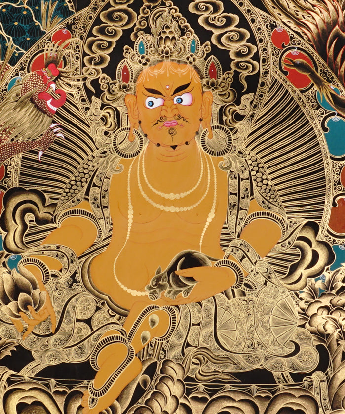 Yellow Zambala Thangka painting with gold detailing, lotus throne, symbolic birds, and Tibetan Buddhist prosperity symbolism.
