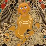 black and gold Zambhala thangka painting showing Tibetan wealth deity with mongoose and intricate gold detailing